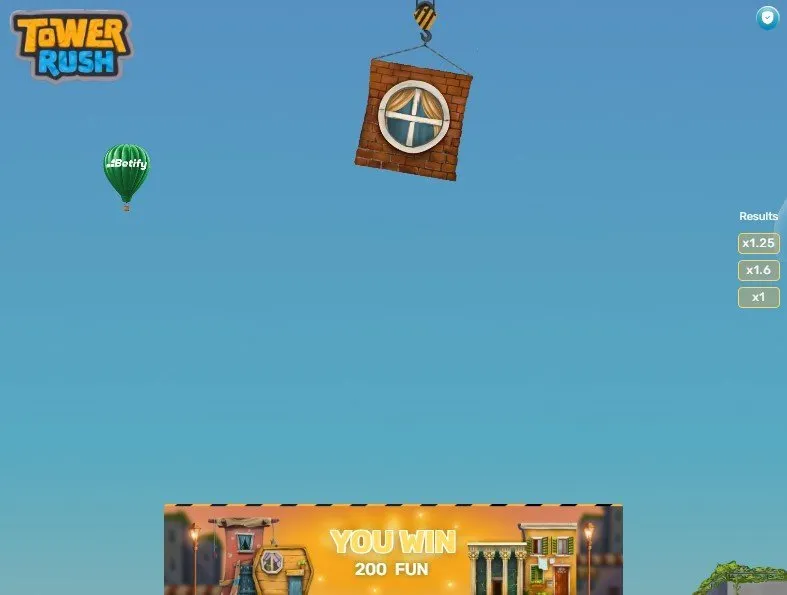 The next block waiting over the tower Brick block hanging from the crane in Tower Rush above a 200 credit win banner